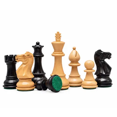 Staunton chess pieces grouped together showing green felt bases