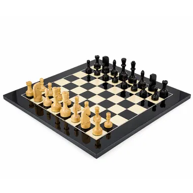 Contemporary complete chess set on black and maple board, overall view