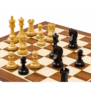 Close-up of knights and ebonised pieces facing the light pieces on the board