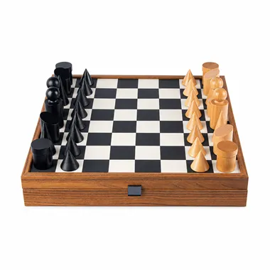 Bauhaus black and white chess set, geometric pieces arranged on the board