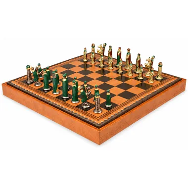 Green and gold medieval chess pieces arranged on the wooden chess board