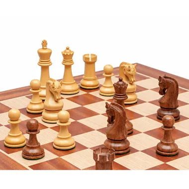 Acacia wood chess pieces at the centre of the board, close-up detail