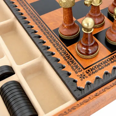 Close-up of the chessboard corner with wooden pieces and faux-leather storage compartment