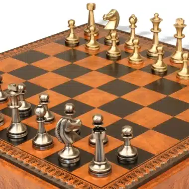 Solid brass Grand Staunton chess pieces set up on the faux leather board