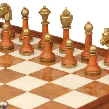 Gold-toned wood and metal pieces, detail of pawns and engraved knight