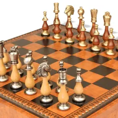 Wood and metal pieces of the Grand Oriental chess set lined up on the board