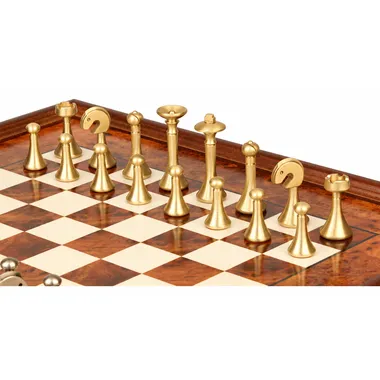 Gold-toned metal pieces shown close up on the burl wood chess board