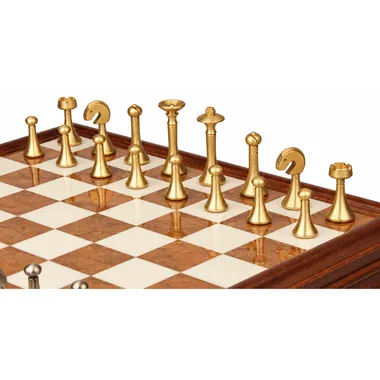 Close-up of gold brass pieces lined up on the alabaster board