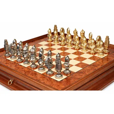 Close-up of gold and silver metal pieces on the Moncada chess board