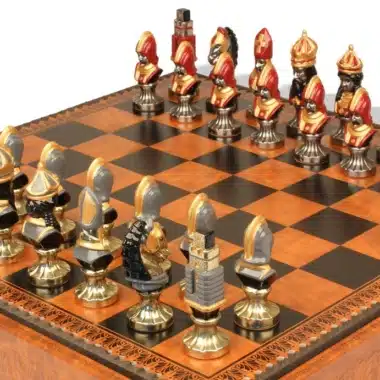 Moncada chess pieces in hand-painted metal lined up on the board