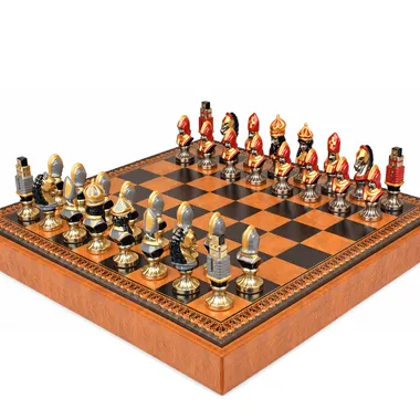 Moncada chess pieces in hand-painted metal lined up on the board
