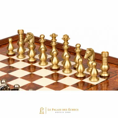 Gold-toned solid brass Garde Française chess pieces seen up close on the board