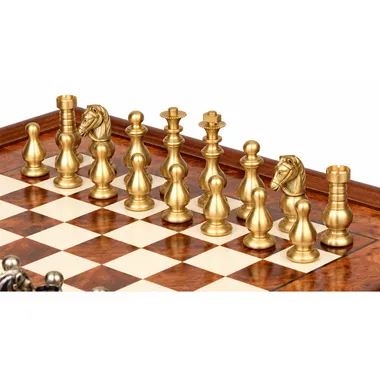 Gold-toned solid brass Garde Française chess pieces seen up close on the board