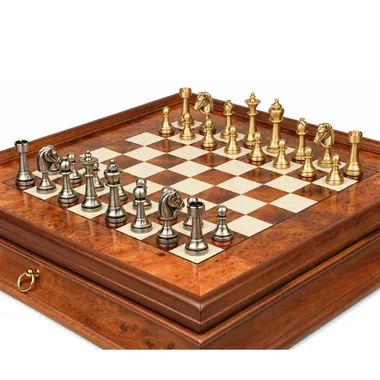 Solid brass Staunton chess pieces arranged on the burl wood chessboard