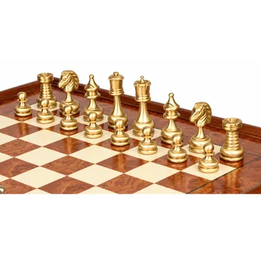 Gold-toned solid brass pieces shown close up on the burl wood board