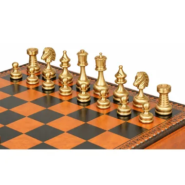 Gold-tone brass pieces of the Grand Persian lined up on the faux-leather board