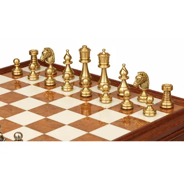 Gold-toned solid brass pieces of the Persian chess set close up on the board