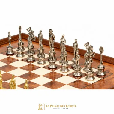 Detailed silver-tone Napoleon chess pieces on the elm wood board
