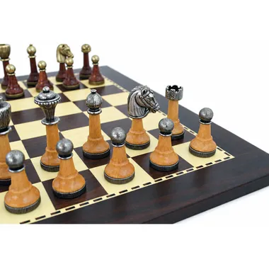 Close-up of light and dark wood pieces, knight and pawns on the board