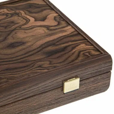 Close-up of the box corner with gold clasp and engraved plaque on the side