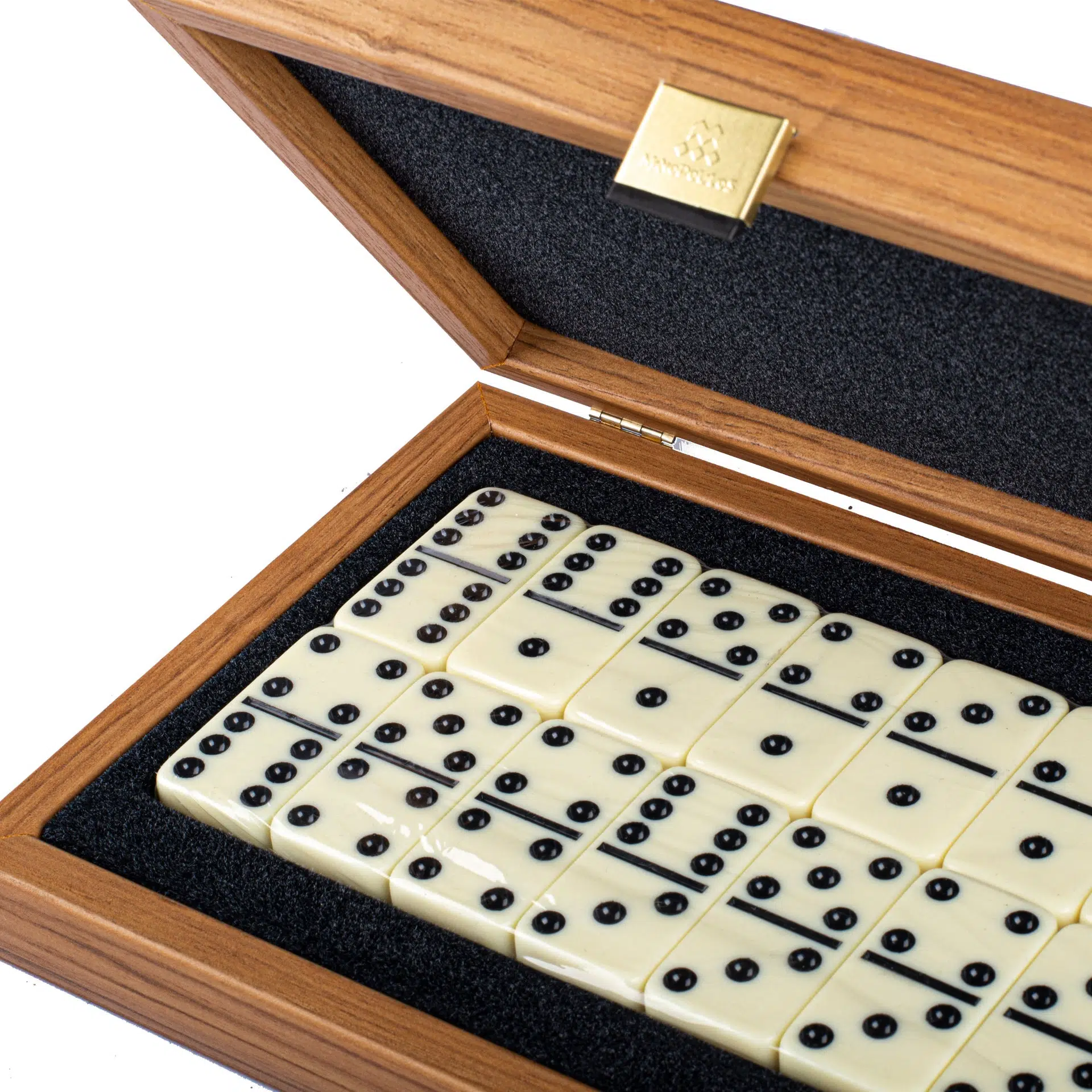 Close-up of the open box with dominoes and engraved gold plaque