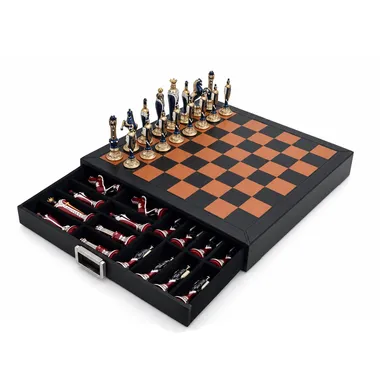 Leather chess board with open drawer showing stored chess pieces