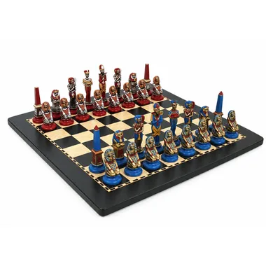 Egypt chess set in painted metal, full view on wooden chess board