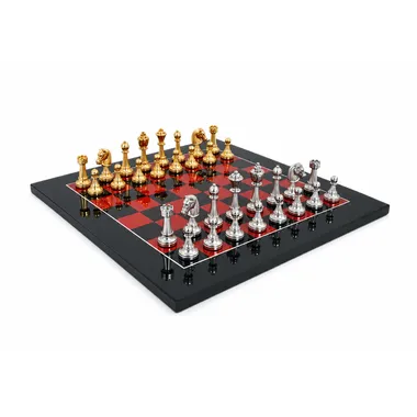 Complete Fleuri chess set on glossy black and red chessboard, overall view
