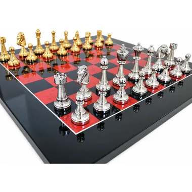 Silver-plated Fleuri pieces lined up on the black and red chessboard