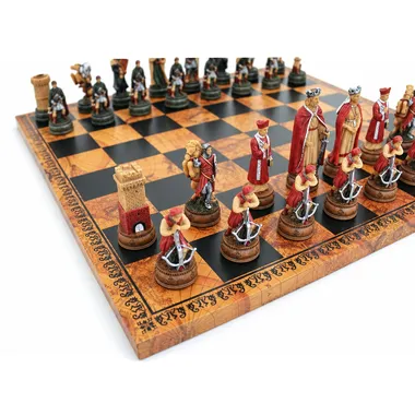 Camelot chess pieces lined up on the board, close-up view