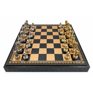 Chess board in gold and black faux leather with gold and silver metal pieces set up