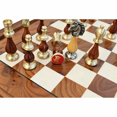 Close-up of solid brass and wood pieces on the burr wood chess board