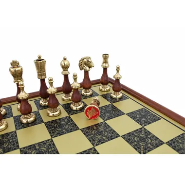 Close-up of wood and metal pieces on the engraved golden board