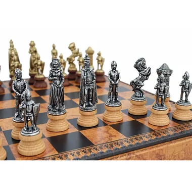 Mary Stuart chess pieces in gold and silver metal on the board