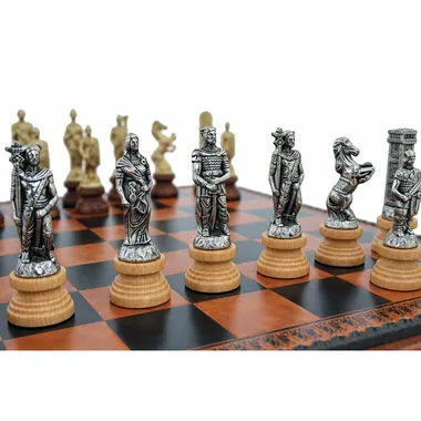 Close-up of silver-toned metal chess pieces representing the Romans on the board