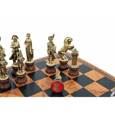 Close-up of gold-tone Napoleon pieces, queen and knight on the board