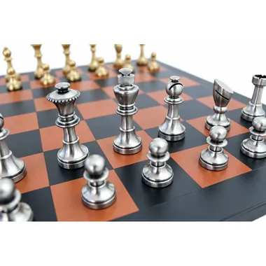 Silver-toned brass pieces: king, queen and bishop close-up on the board