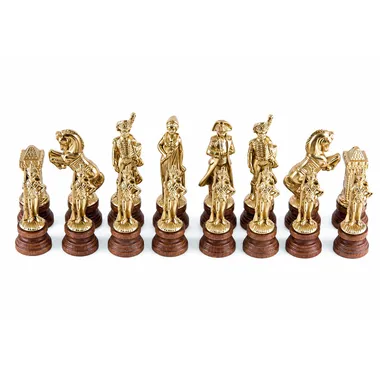 Napoléon chess pieces in gold-toned metal lined up on wooden bases