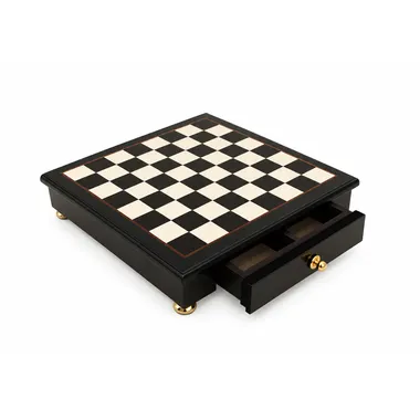 Black and white wooden chess board on a stand with open storage drawer
