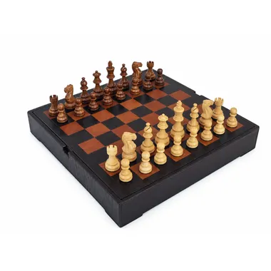 Acacia wood chess set arranged on the leather chess board with storage box