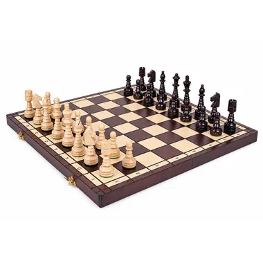 Complete wooden chess set on a folding board, pieces set up for play
