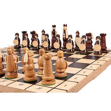 Viking-themed chess set on a wooden chess board, close-up view