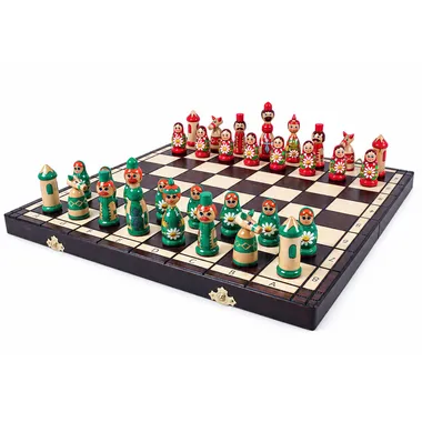 Babushka green chess set arranged on the open wooden chess board