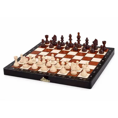 Small magnetic wooden chess set, pieces in starting position on open box