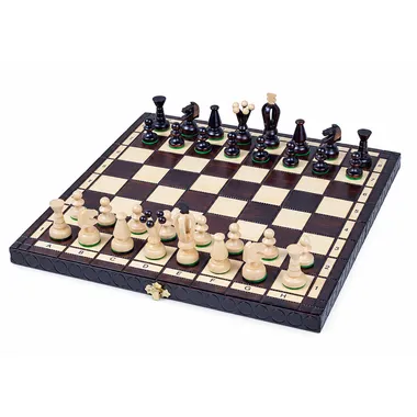 Chess set and folding wooden board, pieces in starting position