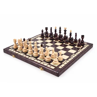 Folding wooden chess set and board, pieces set up ready to play