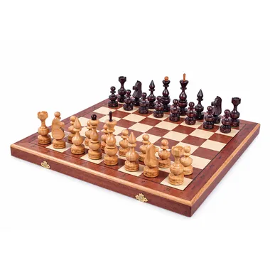 Complete foldable chess set arranged on wooden board with storage