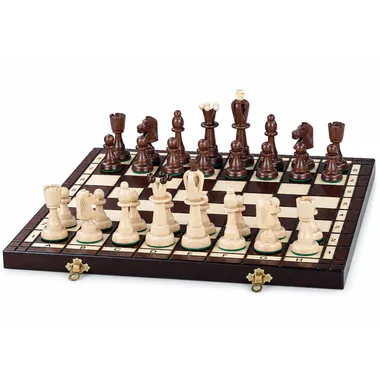 Complete wooden chess set arranged on the folding board with storage