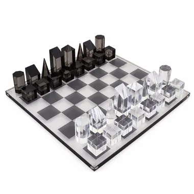 Cube design chess set in grey and clear acrylic on a light chessboard
