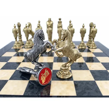 Close-up of the silver and gold knights facing each other on the board